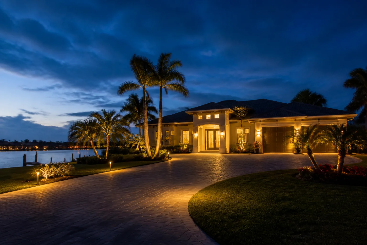 Illustrative coastal Florida home at blue hour with architectural and landscape lighting